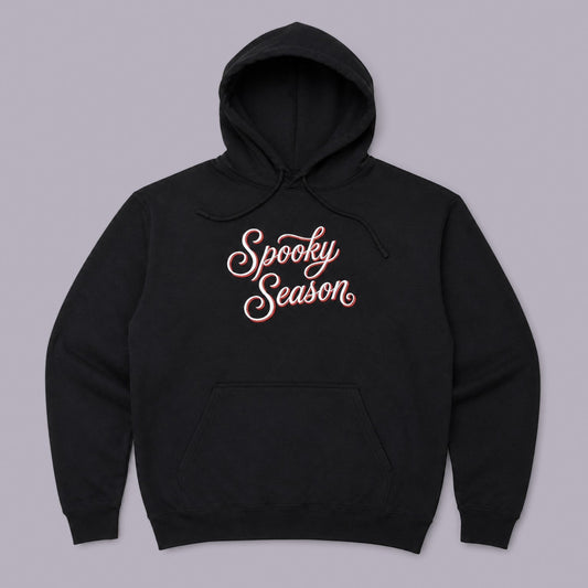 Spooky Season Embroidered Hoodie — Black — product view on grey-purple background