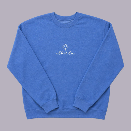 Alberta Maple Leaf Embroidered Crewneck — Blue — product view on grey-purple background