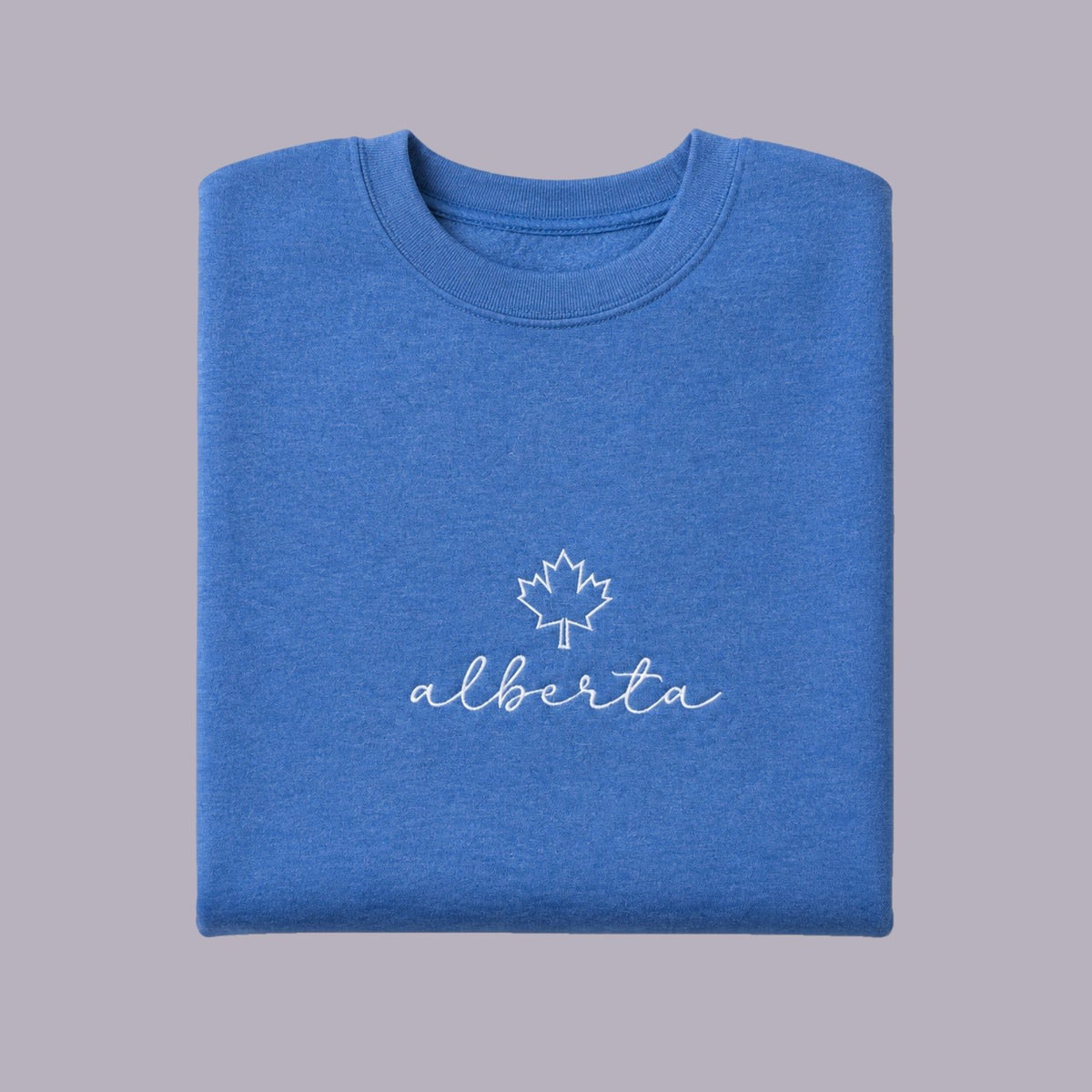 Alberta Maple Leaf Embroidered Crewneck — Blue — product view on grey-purple background