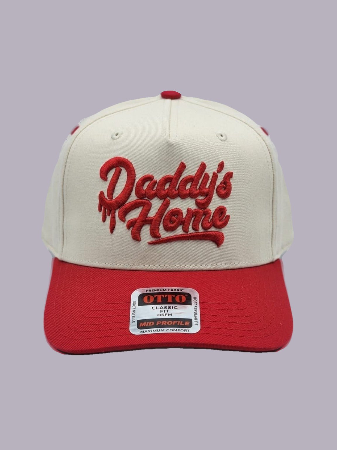 Daddy’s Home Embroidered Hat — Cream & Red — product view on grey-purple background