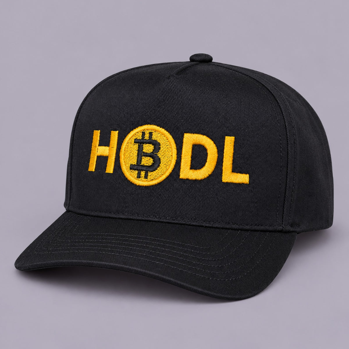 Angled view of black HODL Bitcoin hat showing golden yellow embroidery and curved brim