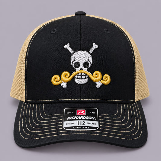 Front of black and Vegas gold Richardson 112 hat with white pirate skull and gold moustache embroidery