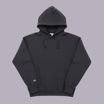 Black hoodie front view on grey-purple background