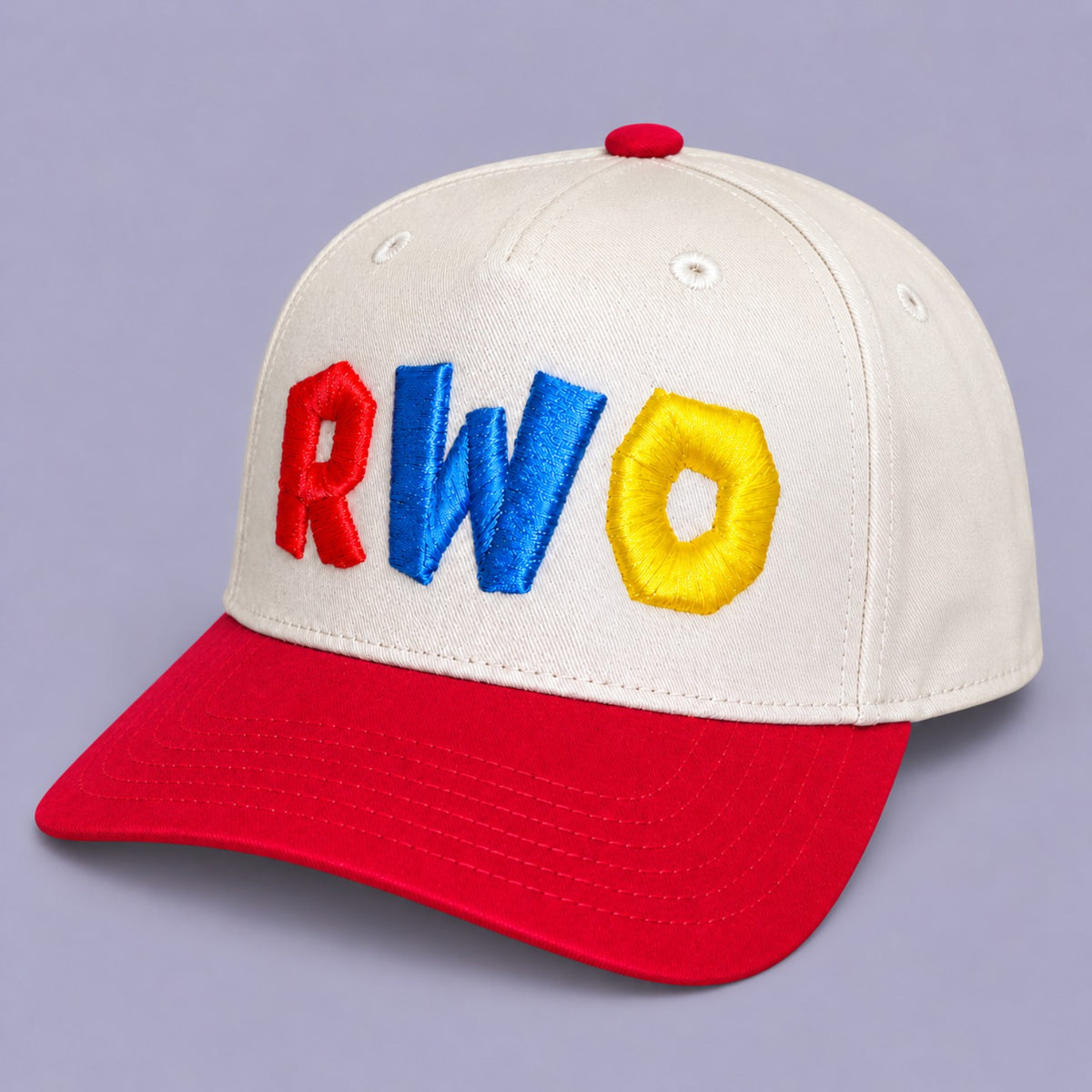 Angled view of cream and red RWO cap with multicolour raised 3D puff embroidery
