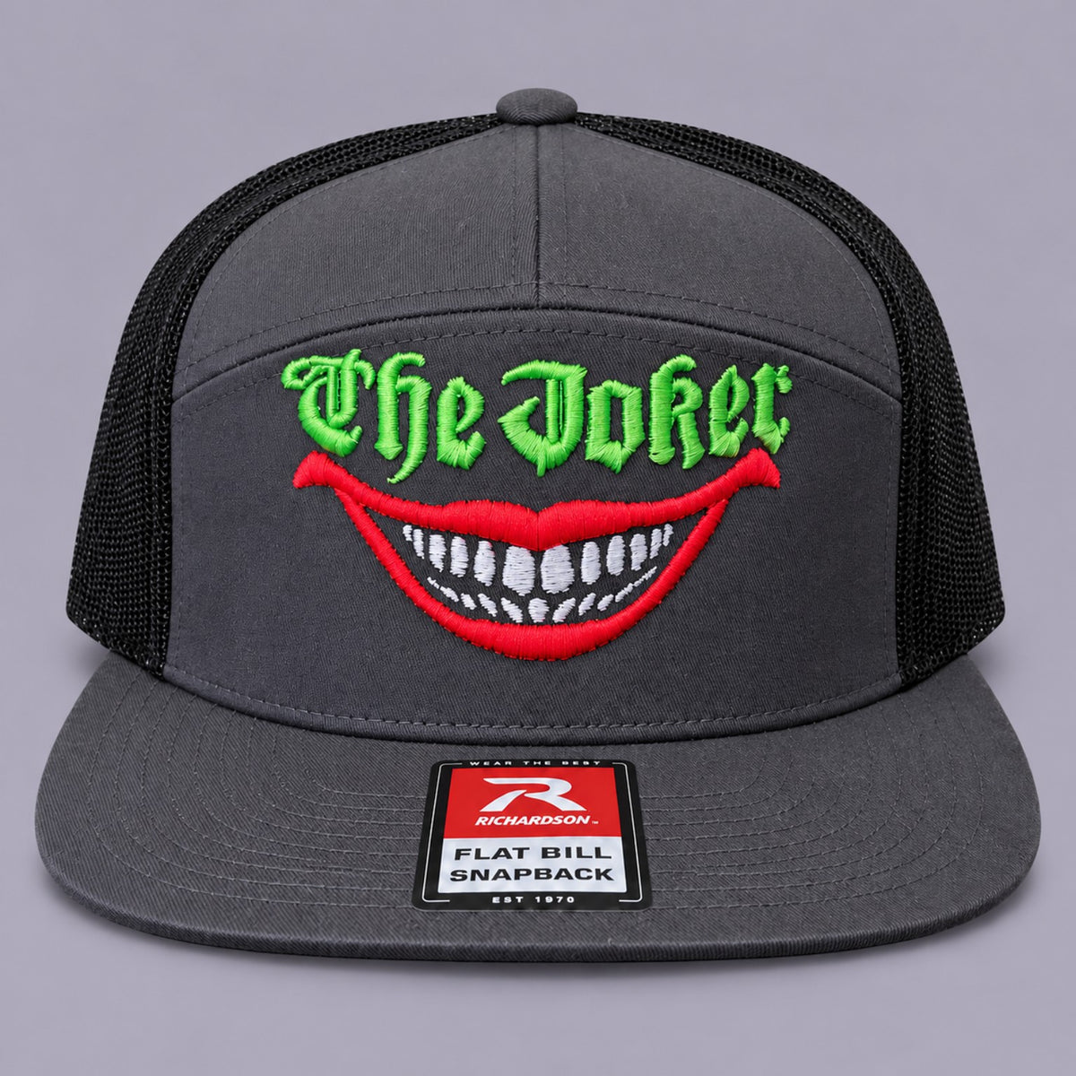 The Joker charcoal Richardson snapback with green lettering and red grin embroidery, front view