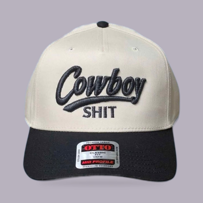 Cowboy Shit Embroidered Hat — Cream & Black — product view on grey-purple background