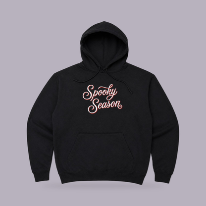 Spooky Season Embroidered Hoodie — Black — product view on grey-purple background