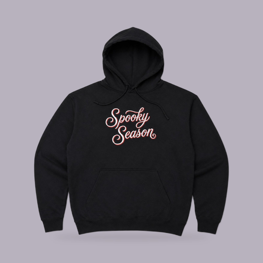 Spooky Season Embroidered Hoodie — Black — product view on grey-purple background