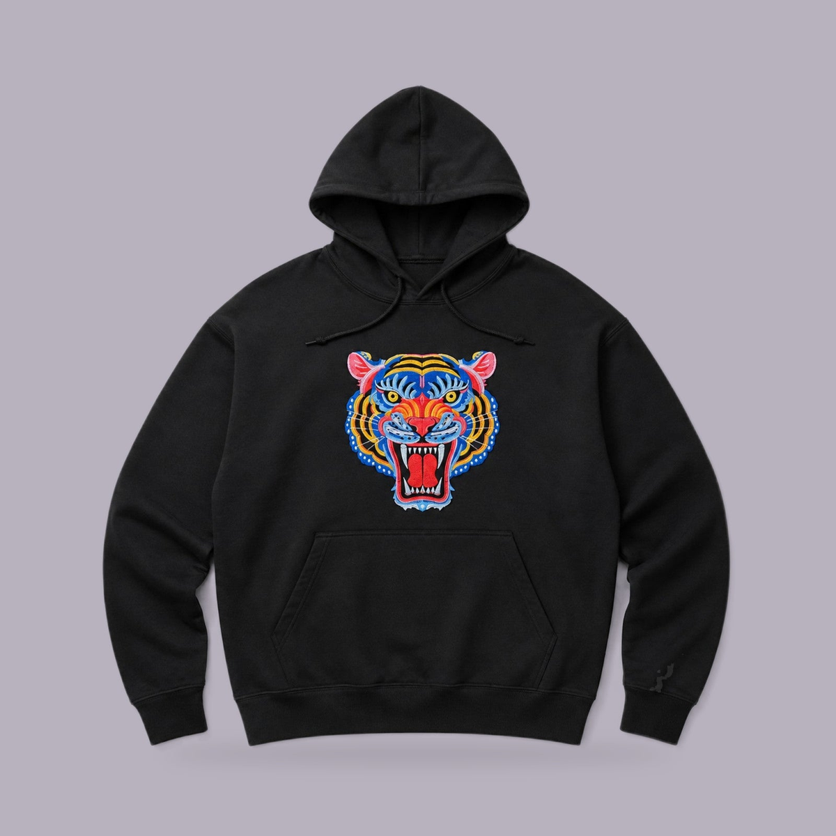 Tiger Embroidered Hoodie — Black — product view on grey-purple background