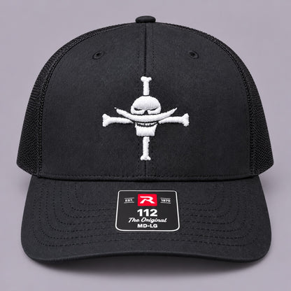 Front view of black Richardson 112 trucker hat with white Whitebeard Pirates embroidery